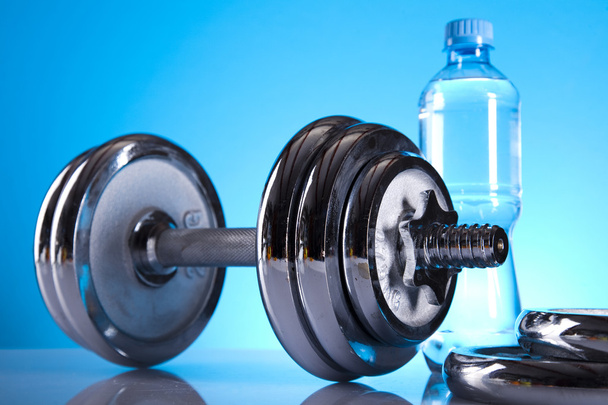 Dumbbell and bottle water - Фото, изображение