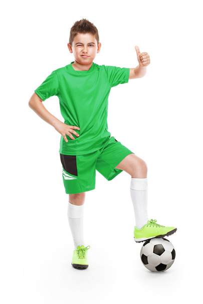 サッカーと立っている若いサッカー選手 - 写真・画像