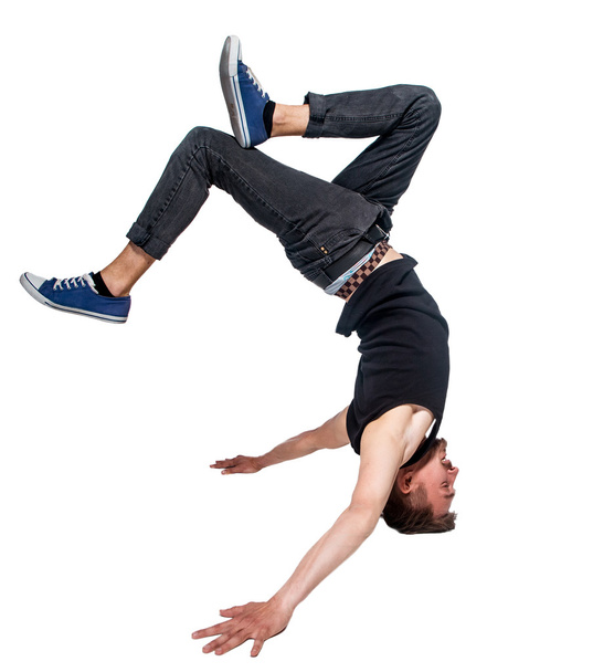 Break dancer doing handstand against  white background - Foto, Imagem