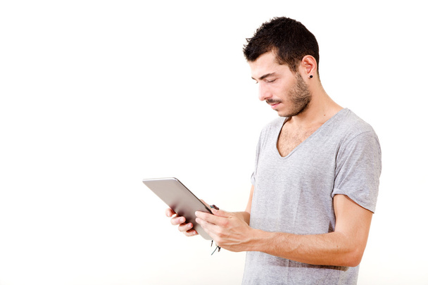 Young man using tablet - 写真・画像