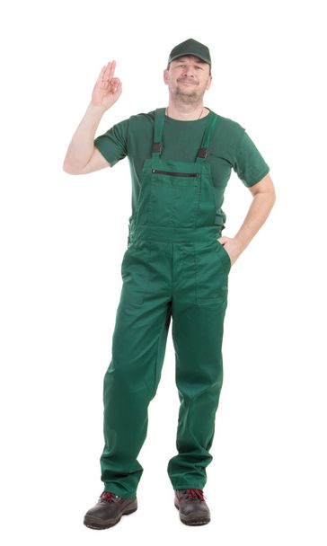 Worker in green overalls.  - Zdjęcie, obraz