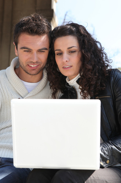 Couple looking at their laptop - Photo, Image