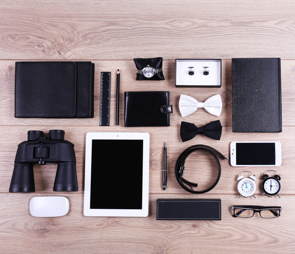 Set of black and white accessories on wooden table, top view - Foto, Imagem