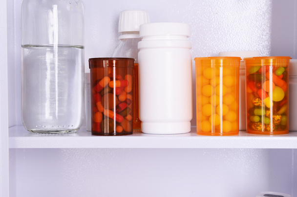 Medicine chest with bottles of pills, closeup - Фото, изображение