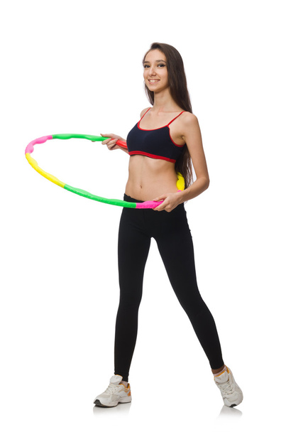 A girl in sport suit with hula hoop isolated on white - Photo, image