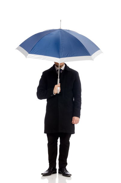 Young man with umbrella isolated on white - Photo, Image