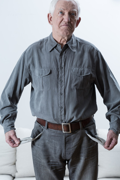 Elderly man with empty pockets - Foto, imagen
