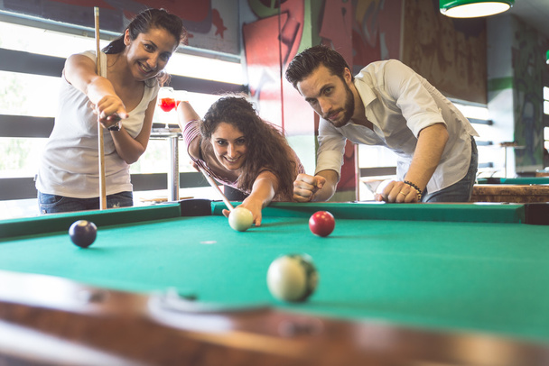 group of friends playing pool - Foto, immagini