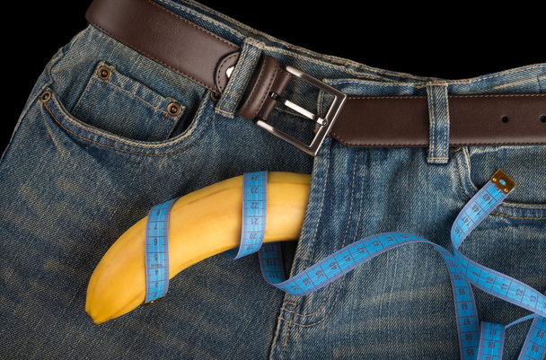 Velký banán jako penis, centimetr a pánské džíny - Fotografie, Obrázek