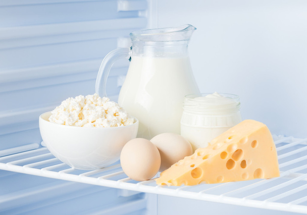 eggs and tasty dairy products: sour cream, cottage cheese, milk, - Photo, Image