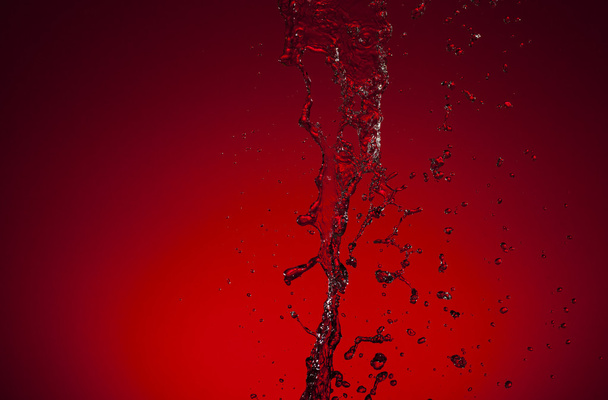 Texture of water on red background - 写真・画像