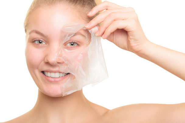 girl removing facial peel off mask - Photo, Image