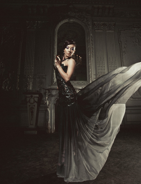 elegance woman with flying dress in palace room - Foto, imagen