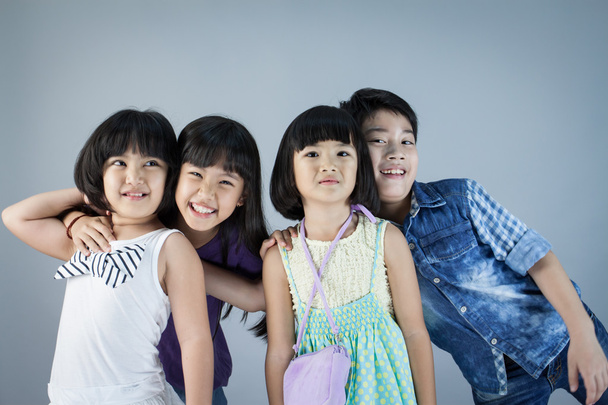 Group of Happy asian child on gray background - Photo, image