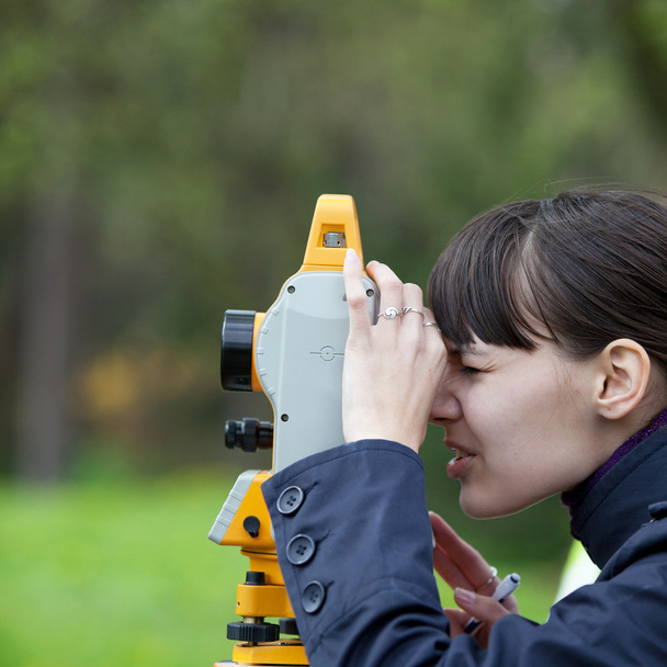Young land surveyor at work - Фото, зображення