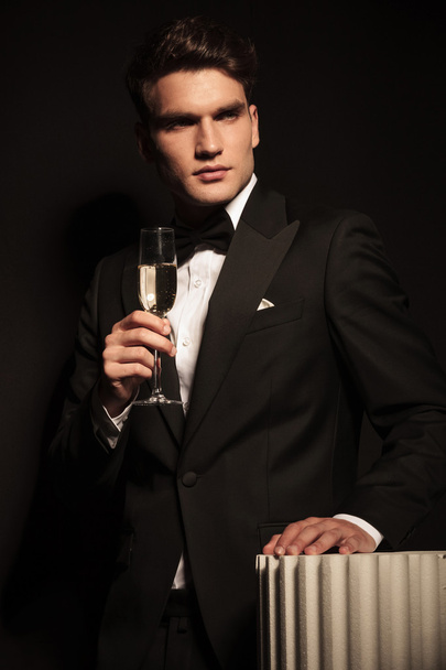elegant business man holding a glass on champagne - Fotografie, Obrázek