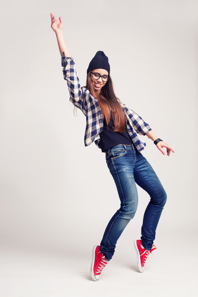 Dancing hipster girl in glasses and black beanie - Foto, Imagem