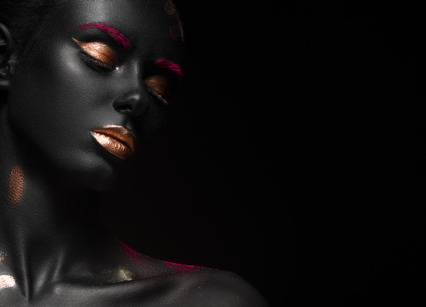 fashion portrait of a dark-skinned girl with color make-up. Beauty face. - Zdjęcie, obraz