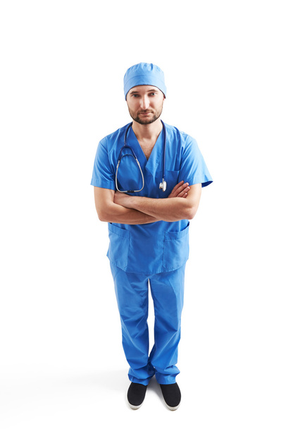 serious man in blue scrubs - Фото, изображение