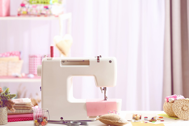 Sewing machine on table in workshop - Foto, Imagem