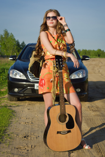 Hippie girl travelling  on a road - Photo, Image