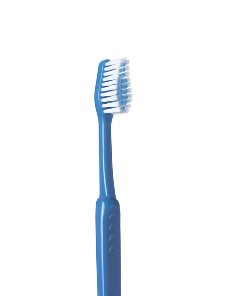 Escova de dentes azul no branco
 - Foto, Imagem