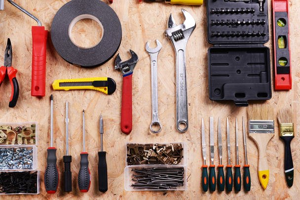Set of tools on plywood, top view - Φωτογραφία, εικόνα