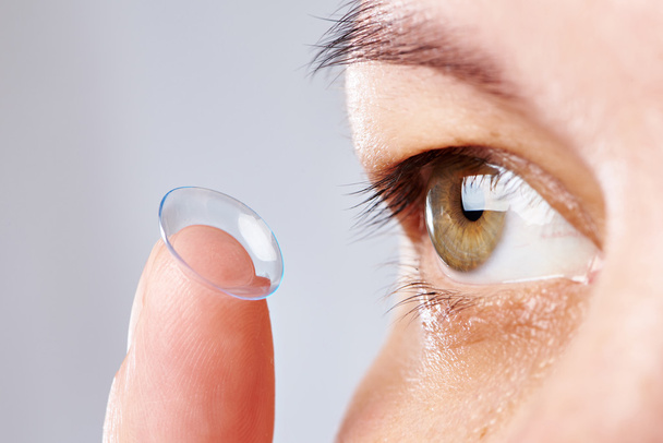 Young womans eye and contact lens - Fotó, kép