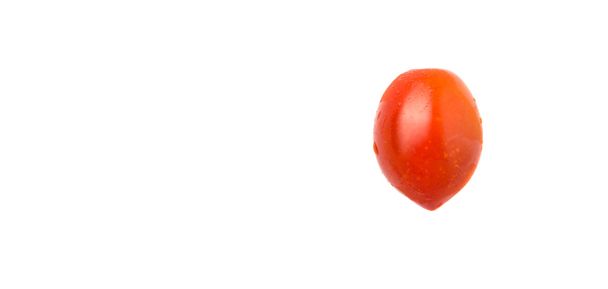 Bite sized red cherry grape tomato over white background - Foto, Imagen