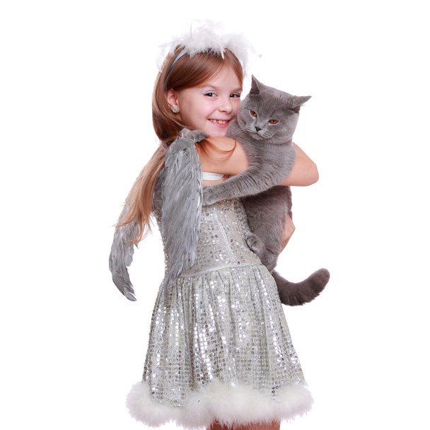 Pretty smiley little angelic girl holding lovely cat - Фото, изображение