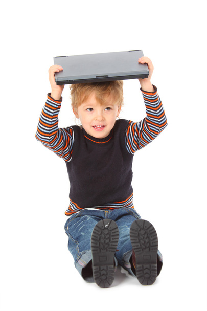 Boy hold laptop on head - Foto, Imagen