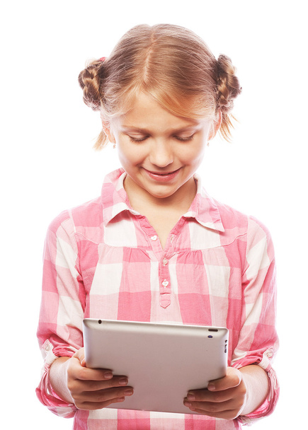 Pretty little girl with a Tablet PC  - Fotó, kép