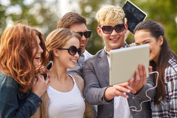students or teenagers with tablet pc taking selfie - Zdjęcie, obraz
