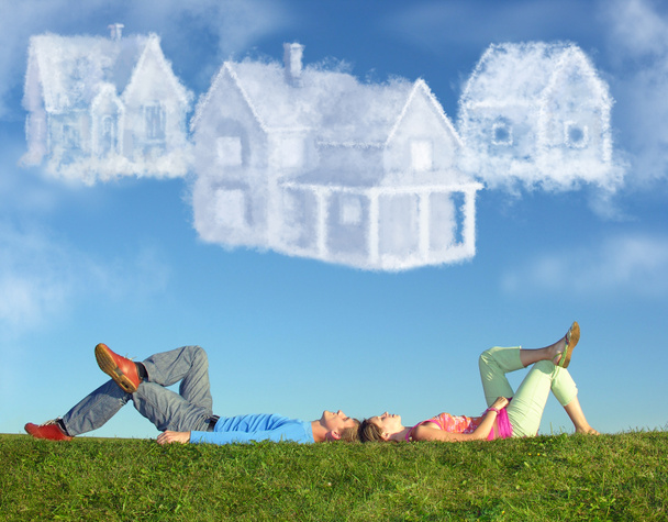 Lying couple on grass and dream three cloud houses collage - Photo, Image