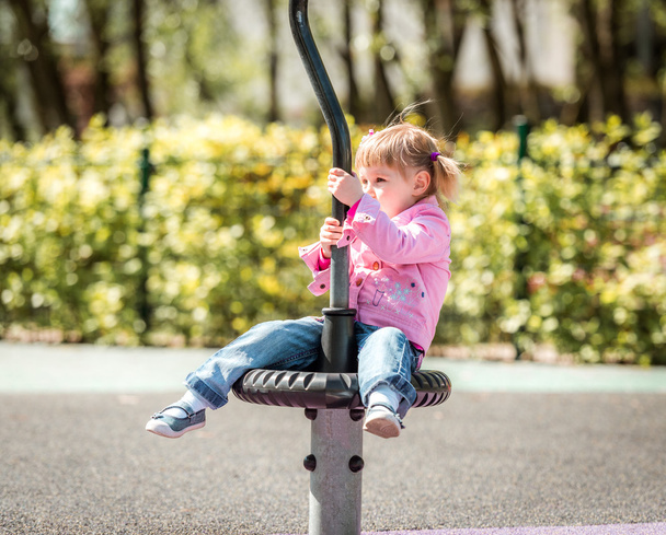 Cute little girl on  playground  - Foto, immagini