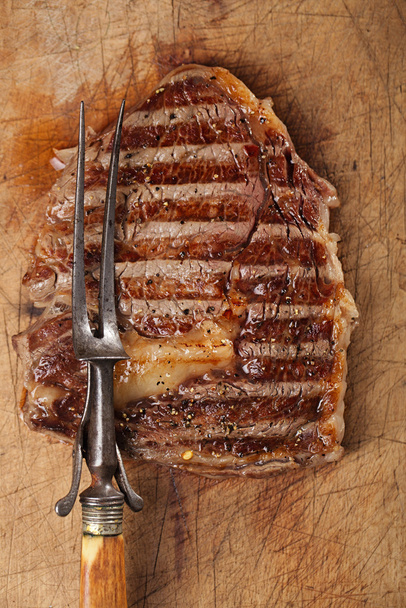 beef steak with vintage meat fork - Photo, Image