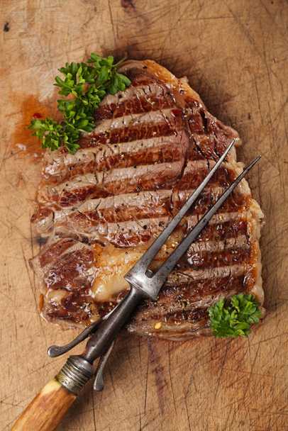 marha steak vintage hús villával - Fotó, kép