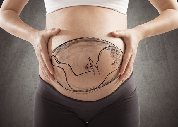 Donna incinta con il suo bambino disegnato
 - Foto, immagini