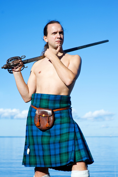 Man with naked torso in kilt - Photo, Image
