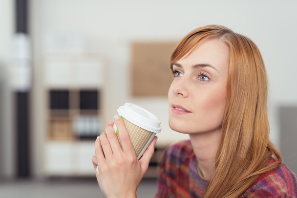 Pensive Woman Holding a Cup of Coffee - Foto, Imagem
