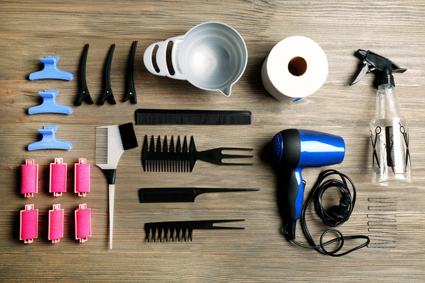 Hairdressing tools on wooden background - Foto, afbeelding