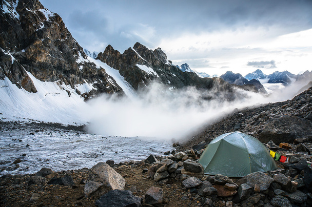 lonely tent climbers in the moutains - 写真・画像