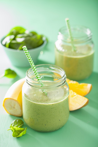 healthy green smoothie with spinach mango banana in glass jars - Photo, Image