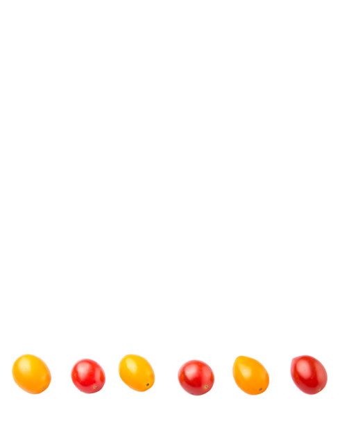 Yellow and red grape tomato over white background - Foto, imagen