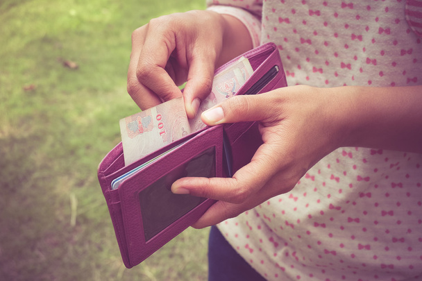 take money from the wallet with filter effect retro vintage styl - Foto, imagen