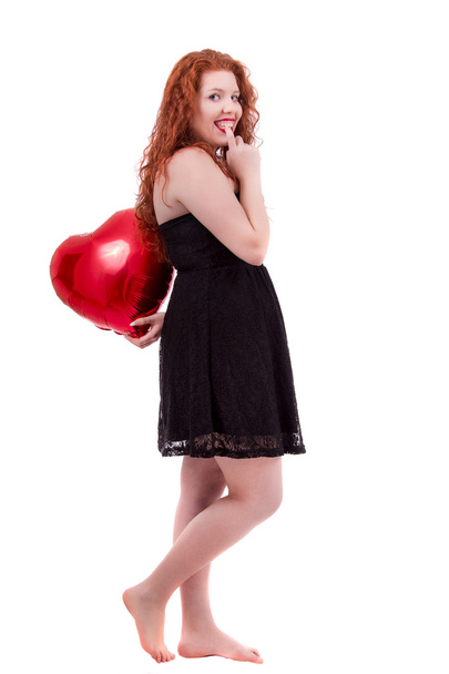 щаслива молода дівчина тримає червону кулю
 - Фото, зображення
