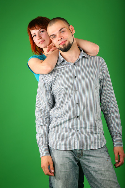 Girl with red hair embraces guy behind - Фото, зображення