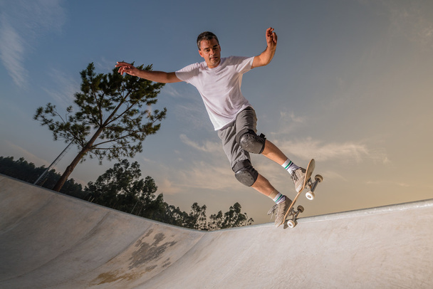 Skateboarder in a concrete pool  - Фото, зображення