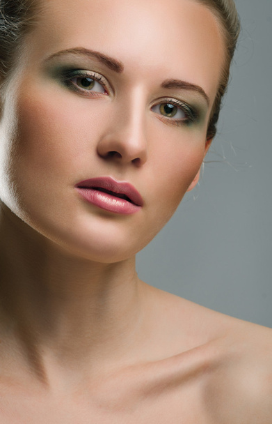 Make-up. Beautiful model with green make up - Photo, Image