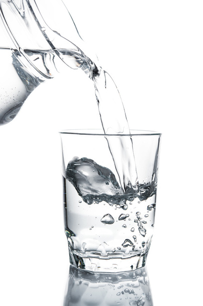 Poured water into glass - Φωτογραφία, εικόνα